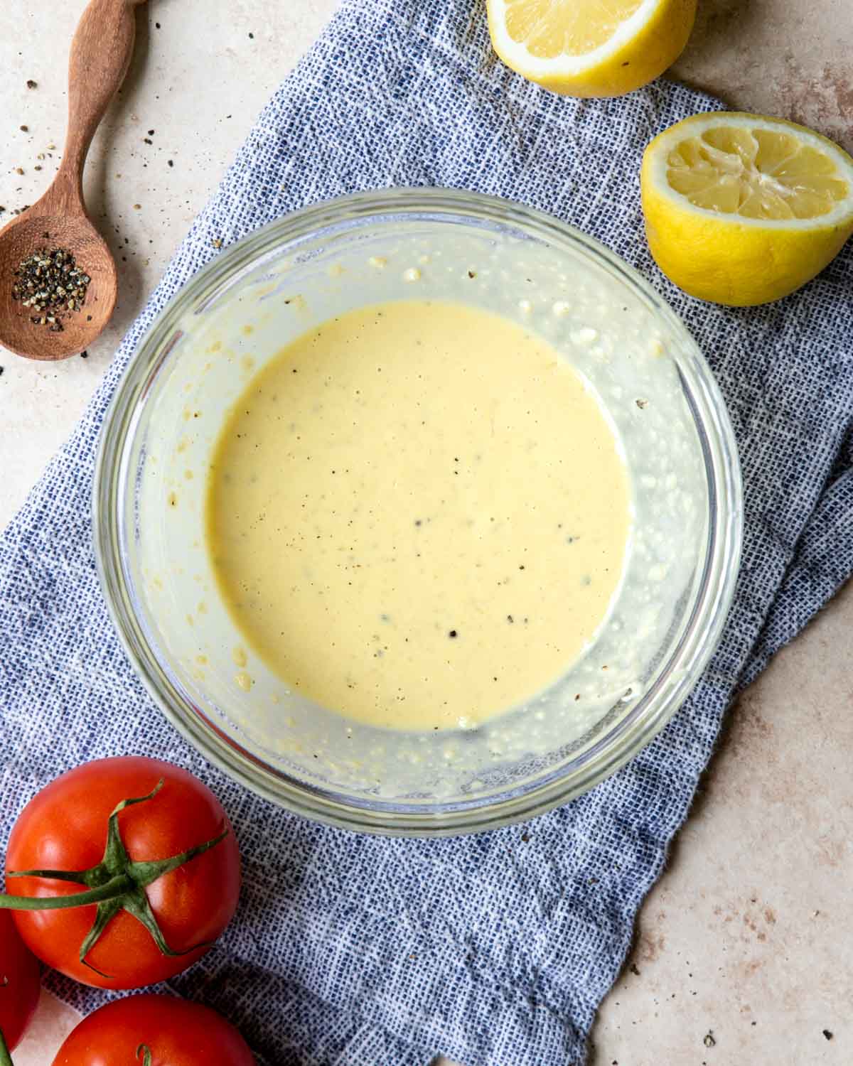 a small bowl of caesar dressing that does not include anchovies