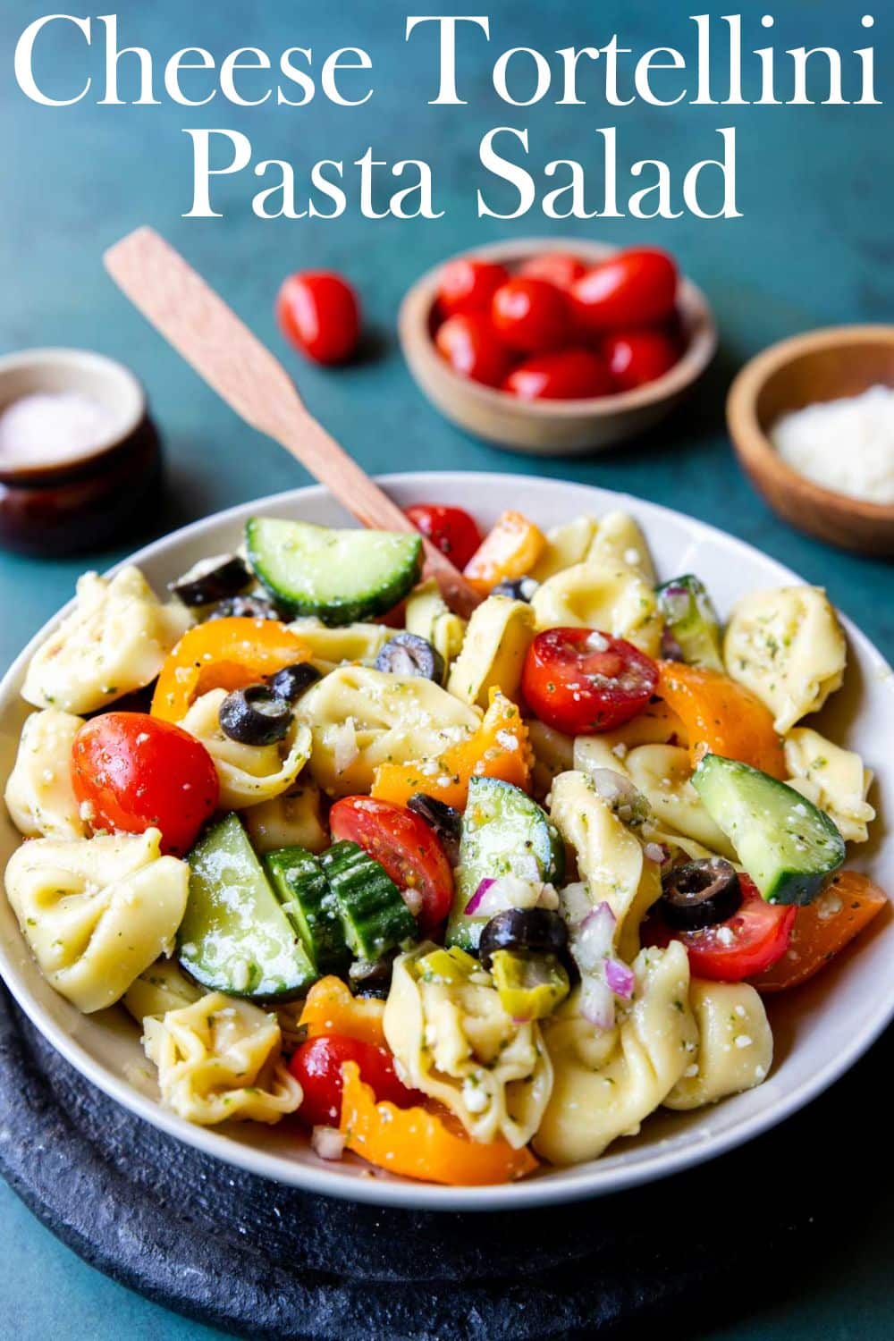 cheese tortellini pasta salad in a bowl with text overlay for Pinterest