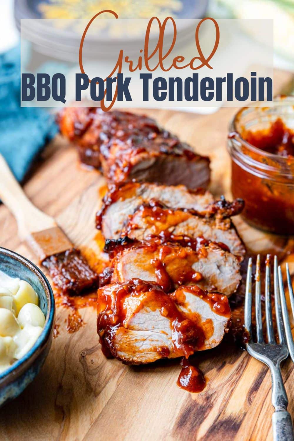 grilled bbq pork tenderloin on a cutting board with text overlay