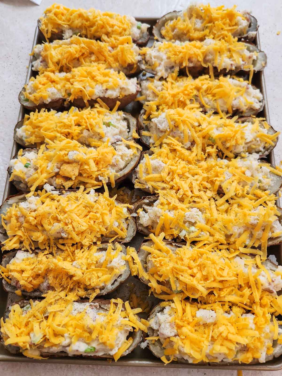 loaded baked potatoes filled and topped with cheese