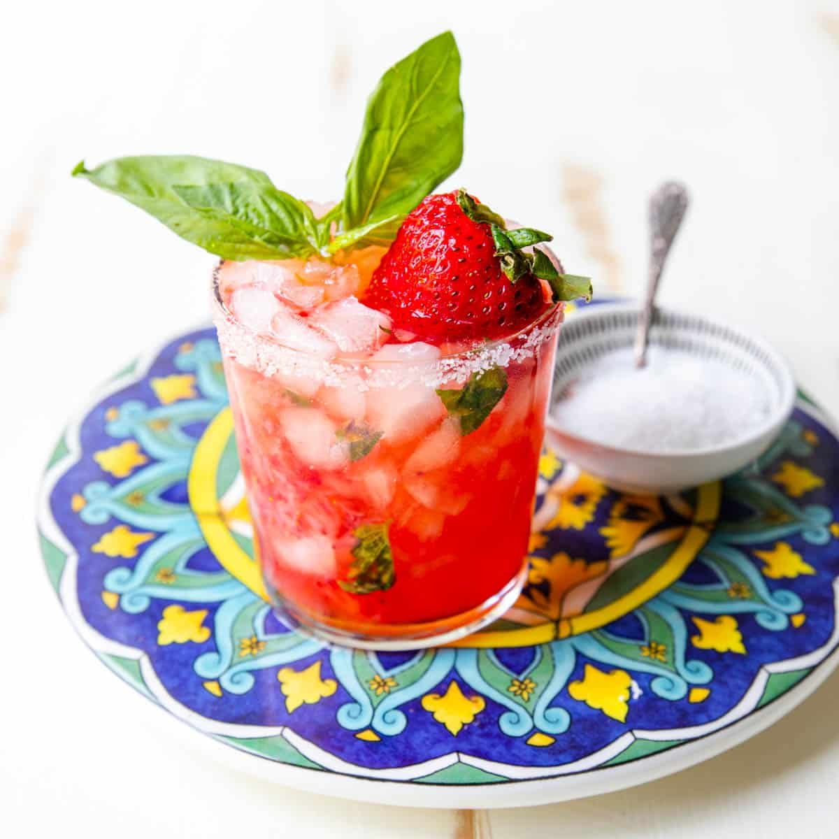 strawberry basil margarita on a blue and yellow plate