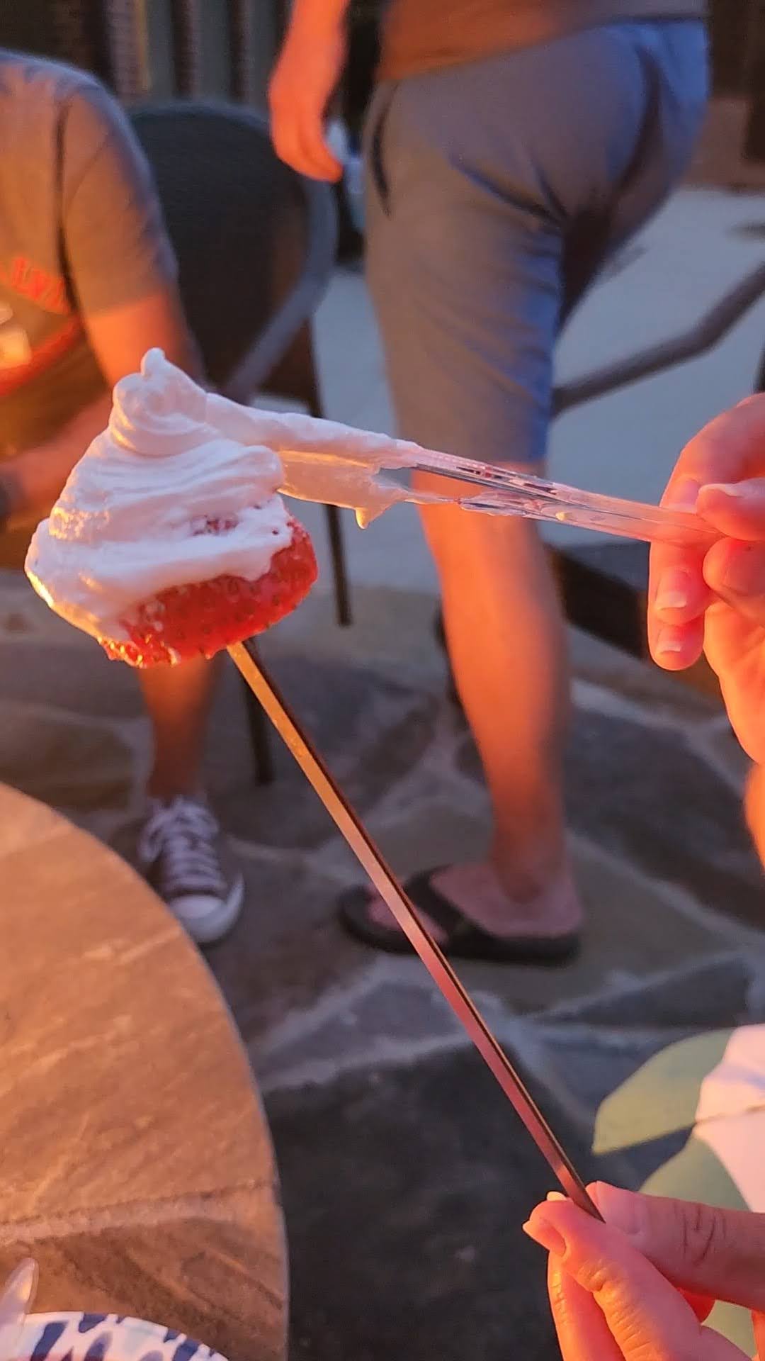 strawberry on a skewer with marshmallow fluff