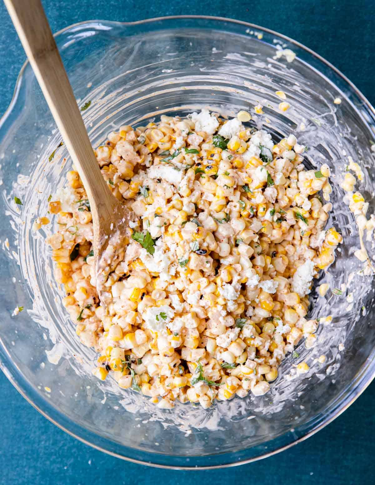 a mixing bowl with street corn salad 