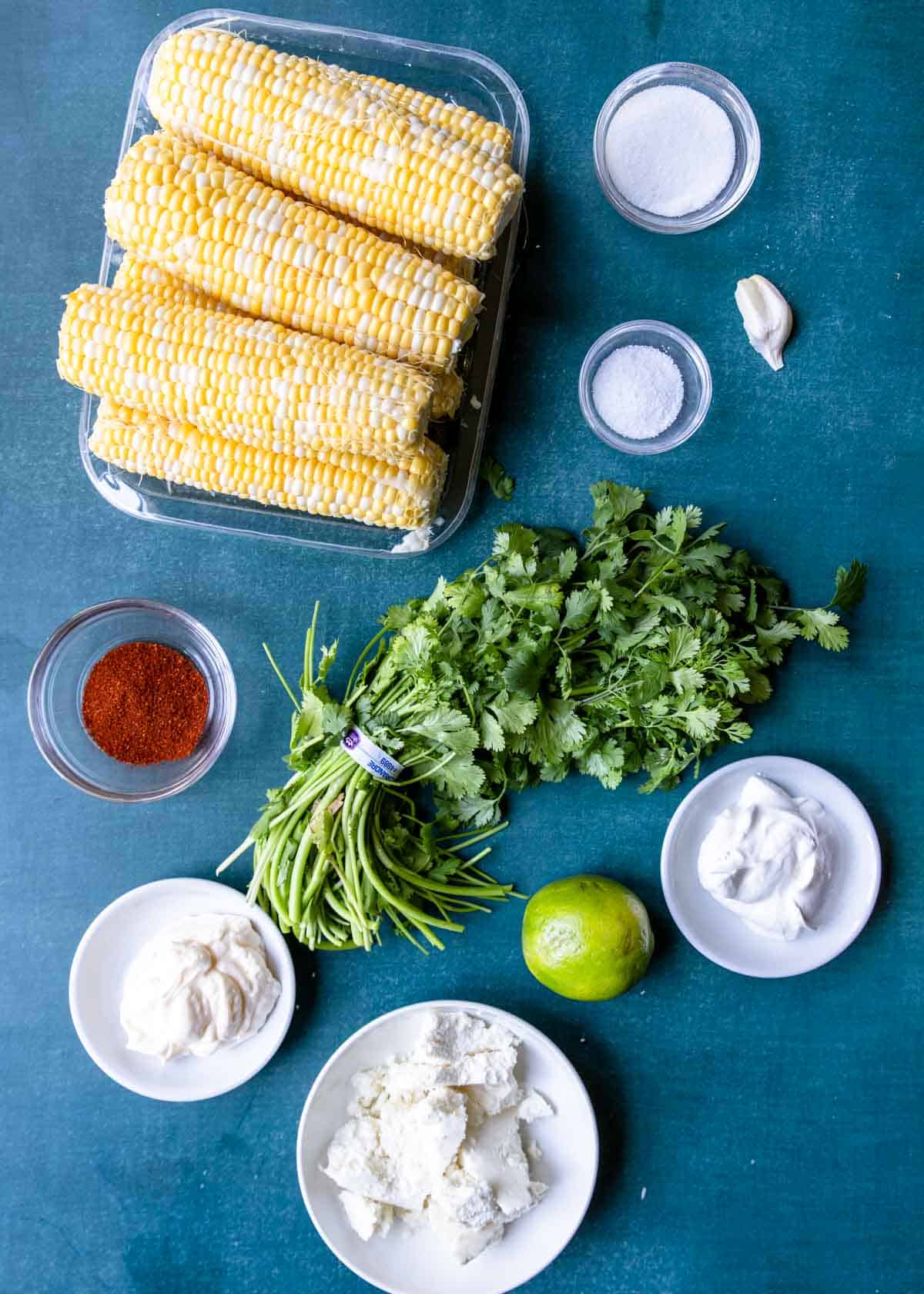 Ingredients laid out on a table to make Mexican Street Corn Salad