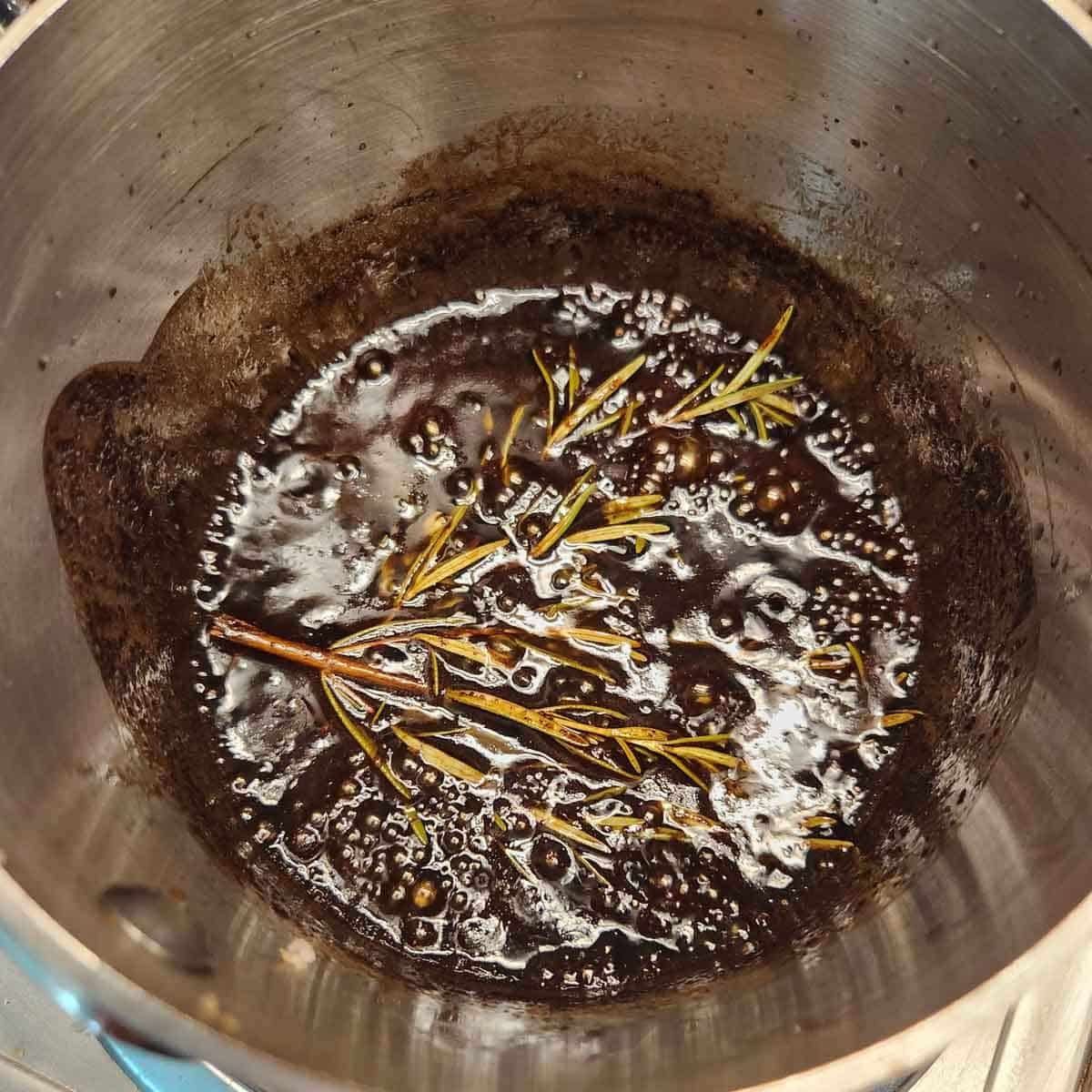 balsamic vinegar and rosemary in a pan