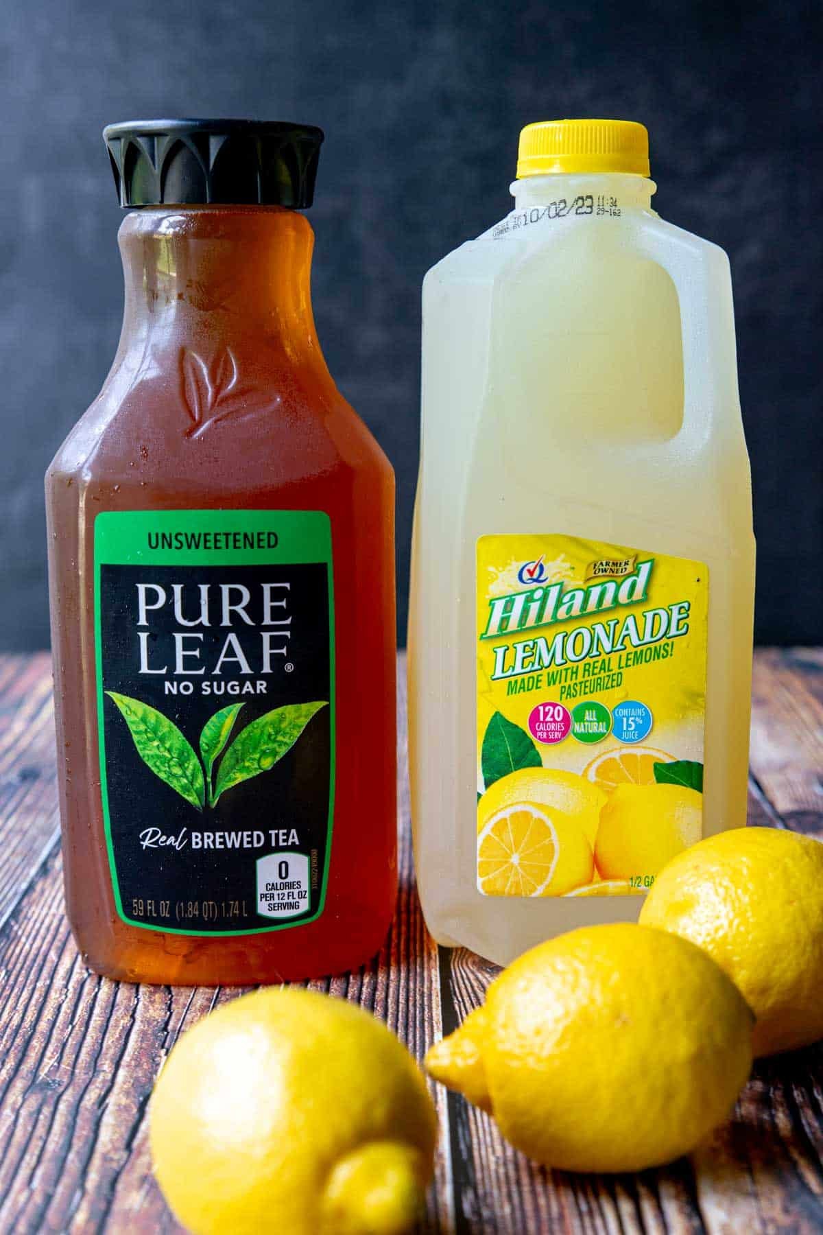 Ingredients for an Arnold Palmer- iced tea, lemonade and lemons