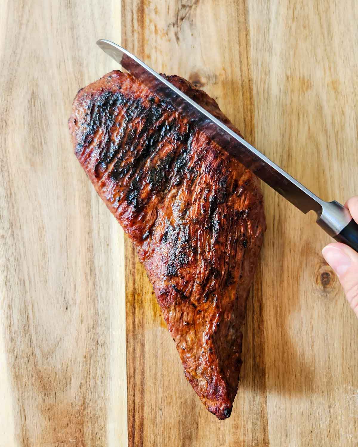 showing the second "against the grain" on a tri tip