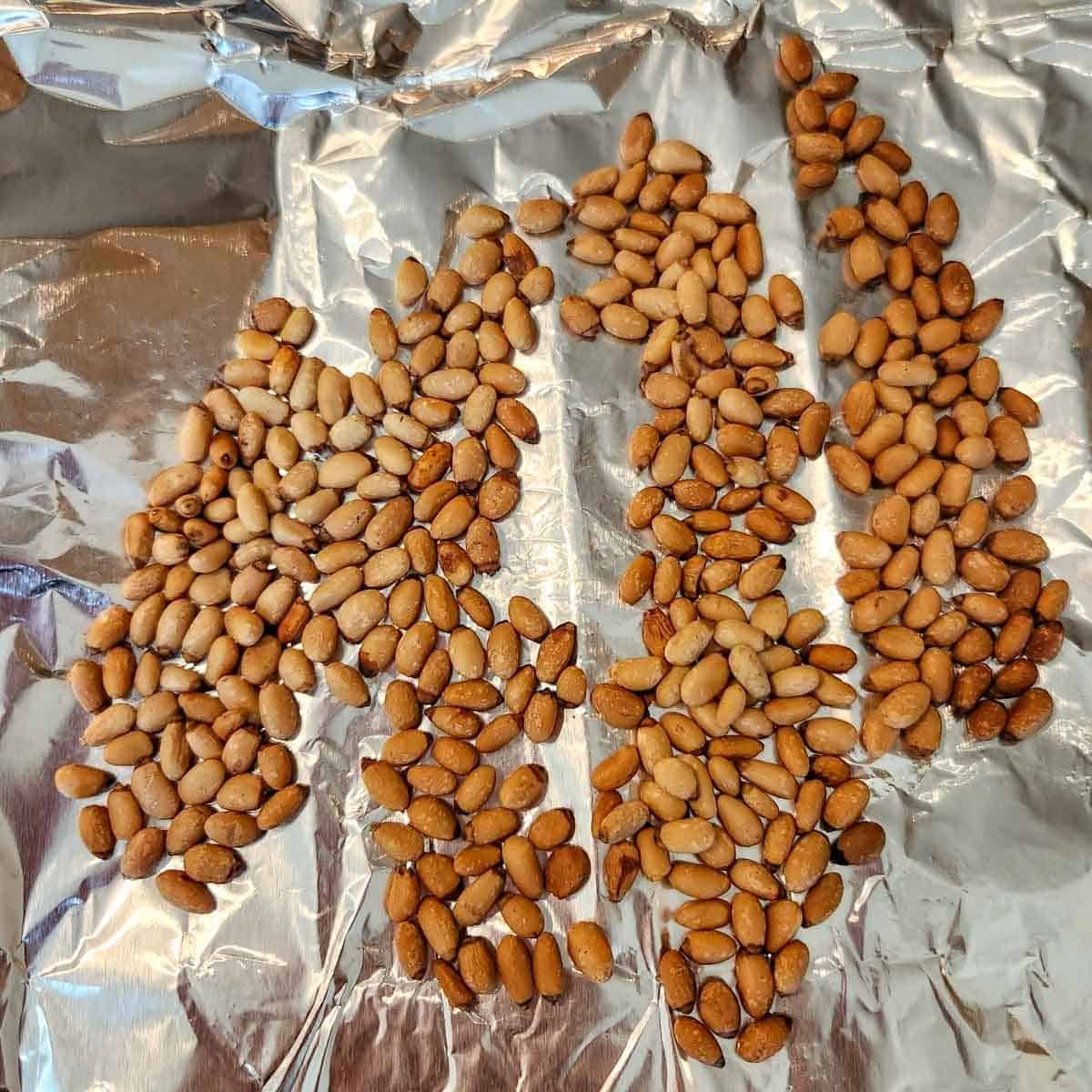 toasted pine nuts on a piece of foil