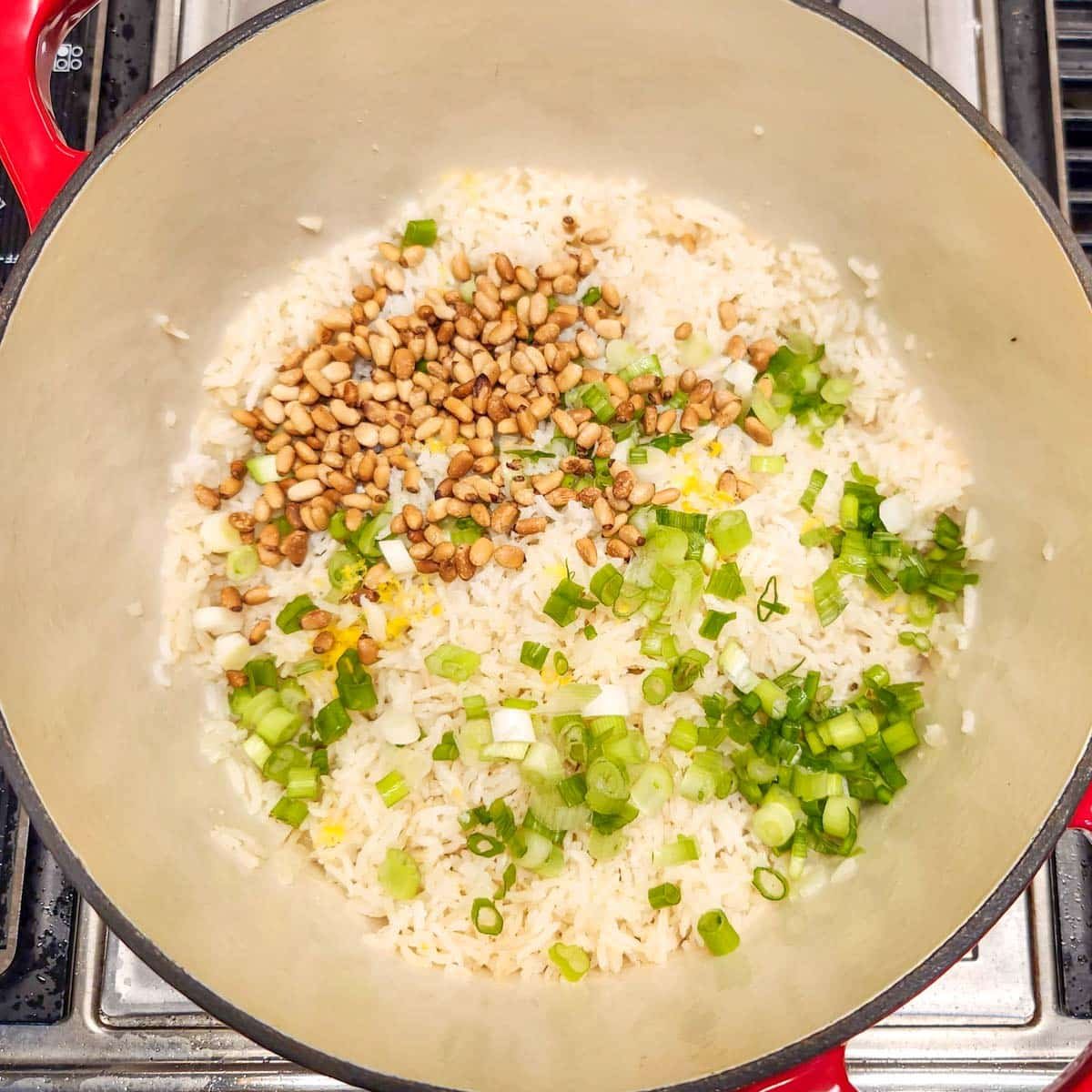 pine nuts, green onions and lemon zest over cooked basmati rice