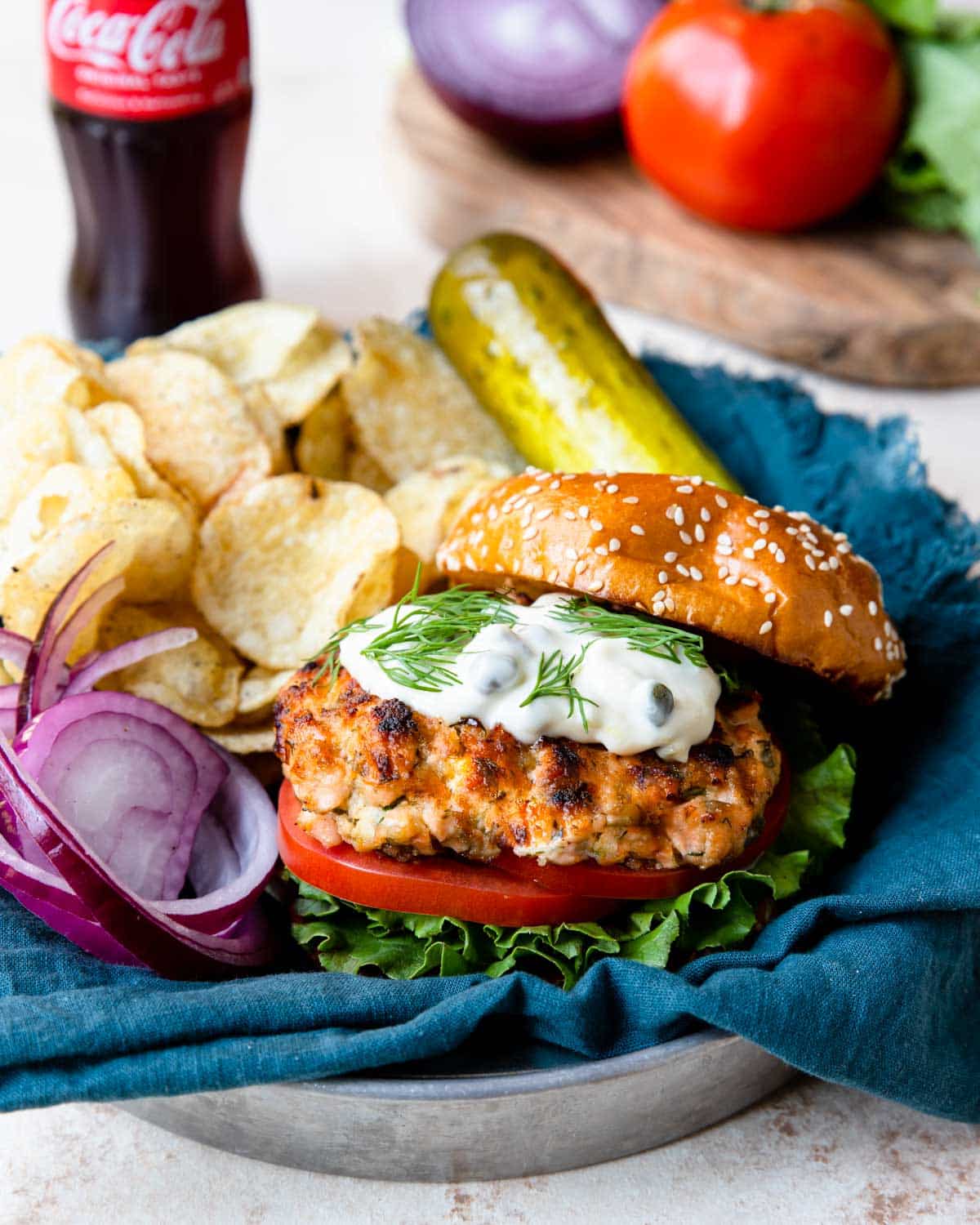 salmon burger topped with lemon caper mayo