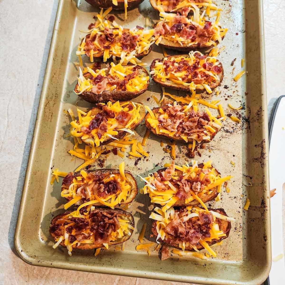 potato skins that are filled with cheese and bacon