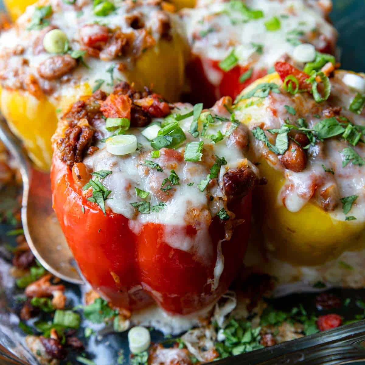 a red bell pepper filled with ground beef, rice and bean mixture