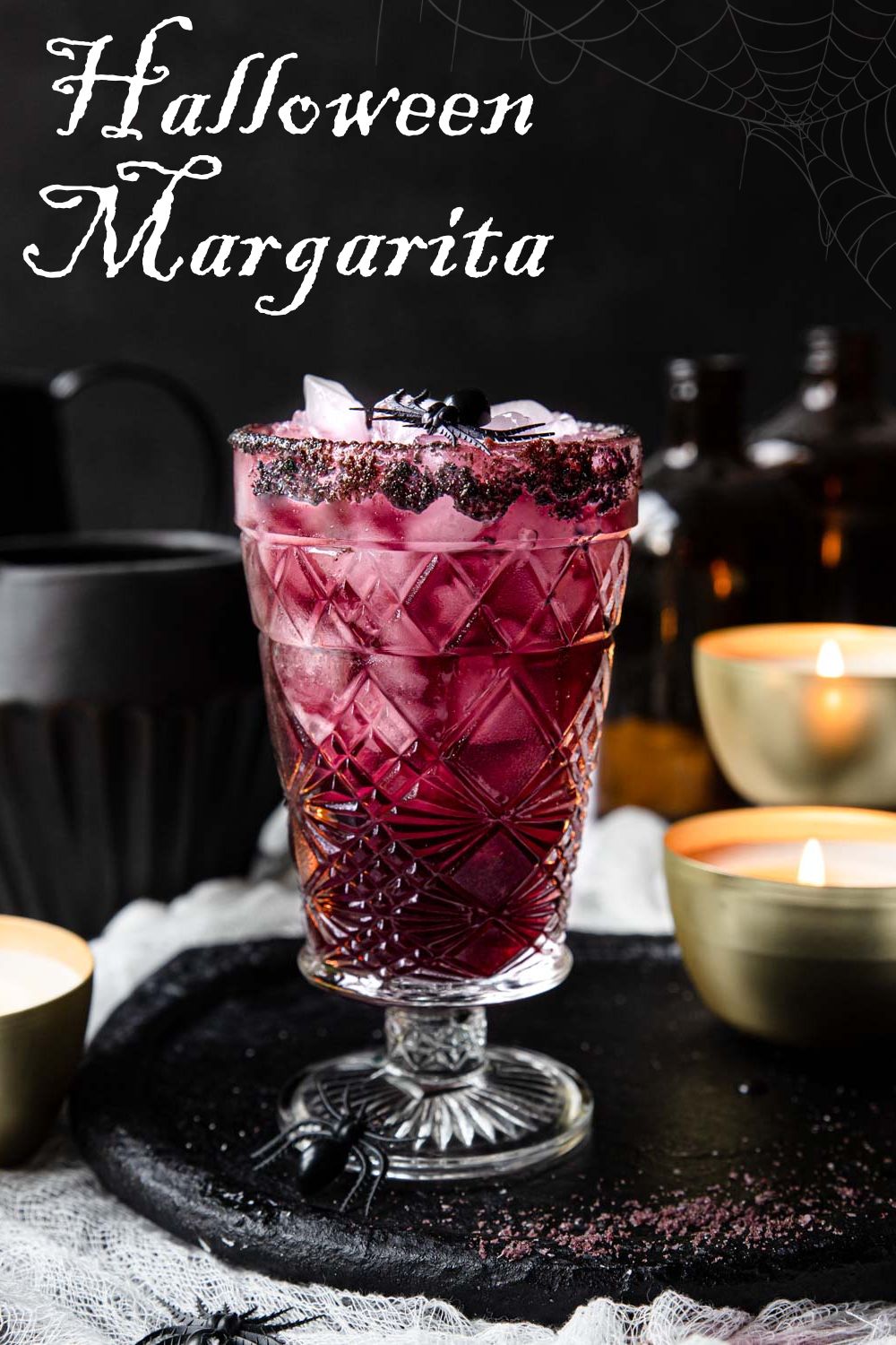 purple margarita on a black plate with text overlay for Pinterest