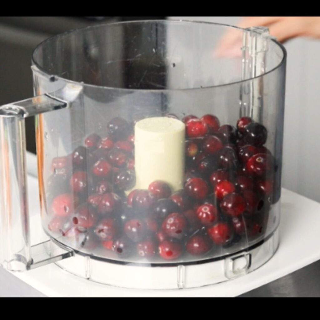 fresh cranberries in a food processor

