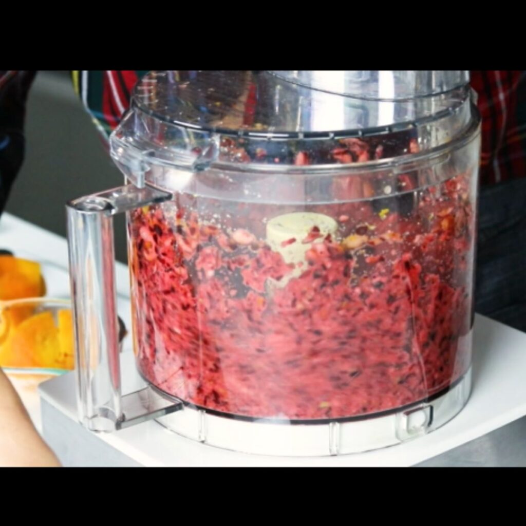 Running a food processor to make cranberry relish