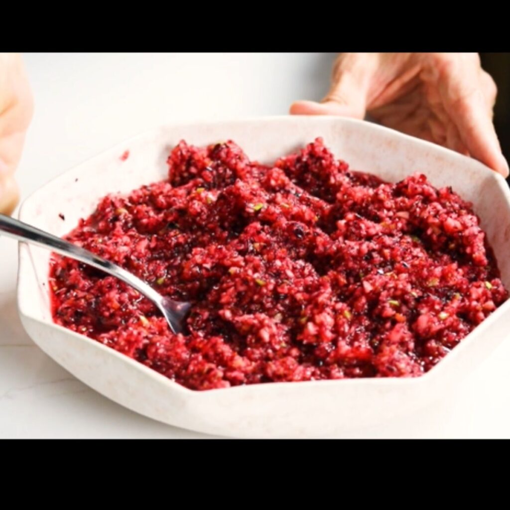 Spooning cranberry relish into a bowl