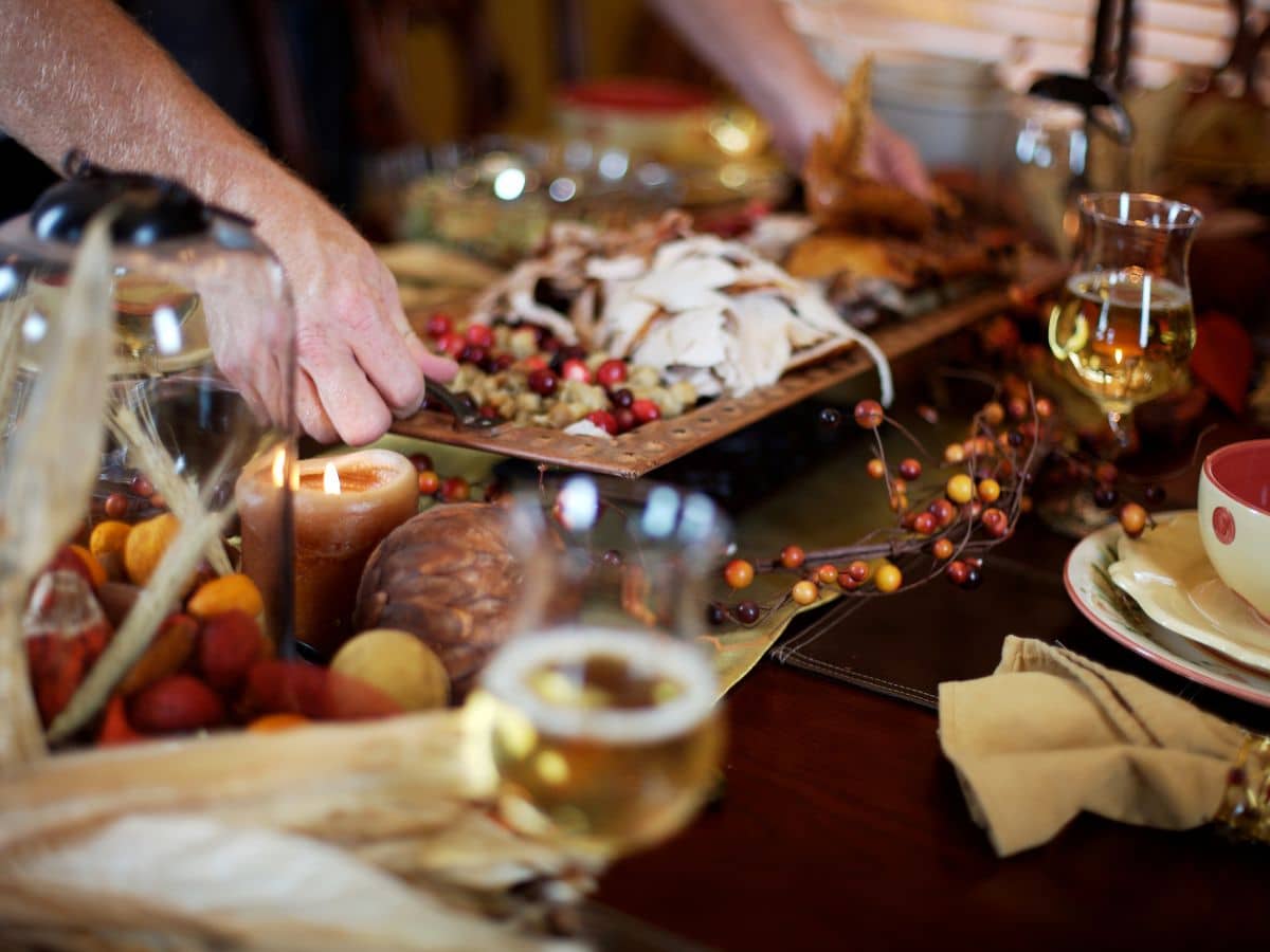 setting dishes onto a holiday table