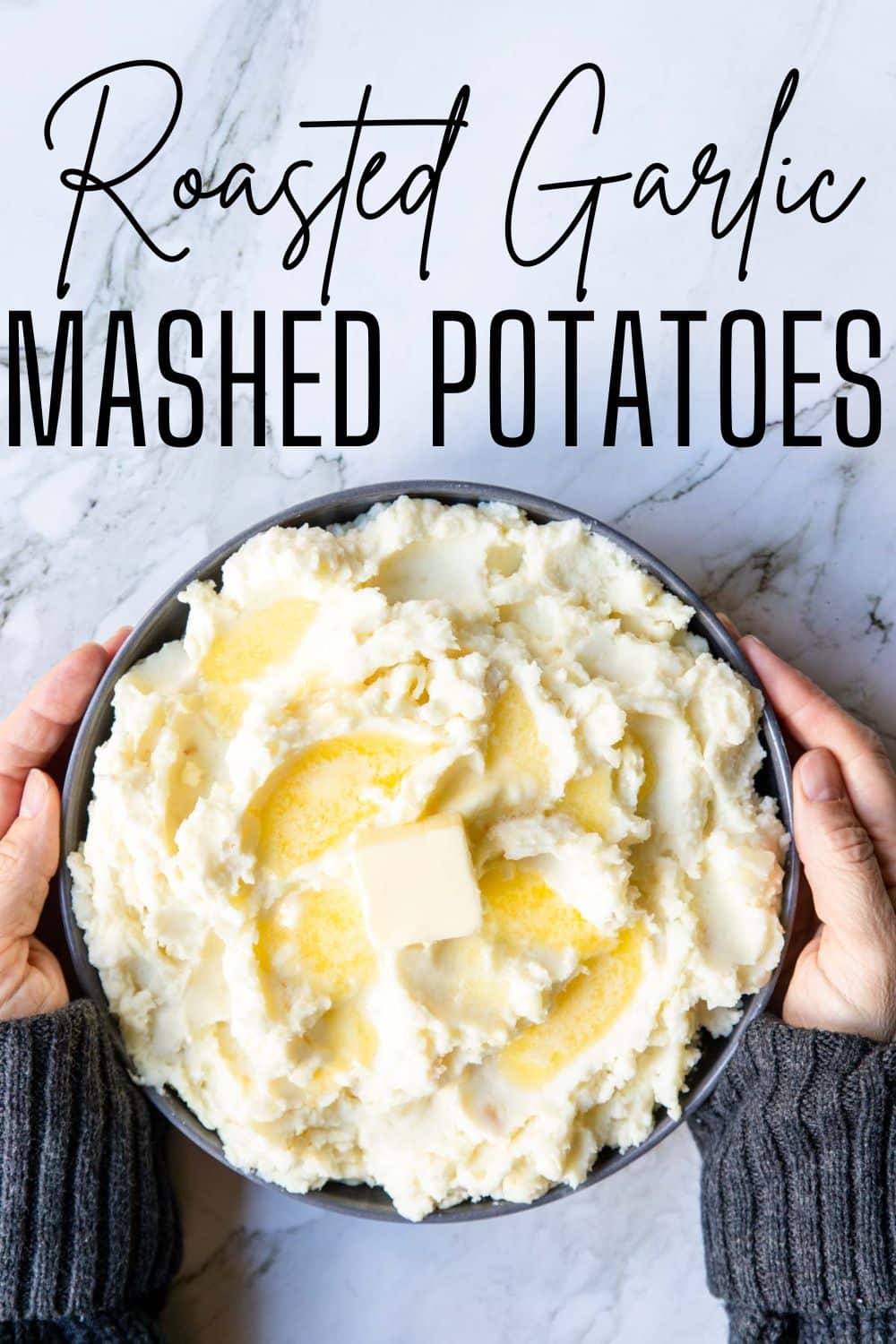 a bowl of mashed potatoes with two hands holding it, with text overlay for Pinterest