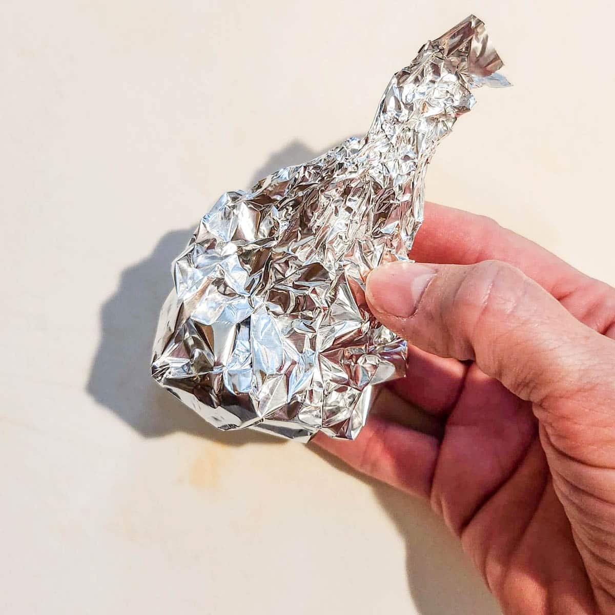 head of garlic wrapped in foil