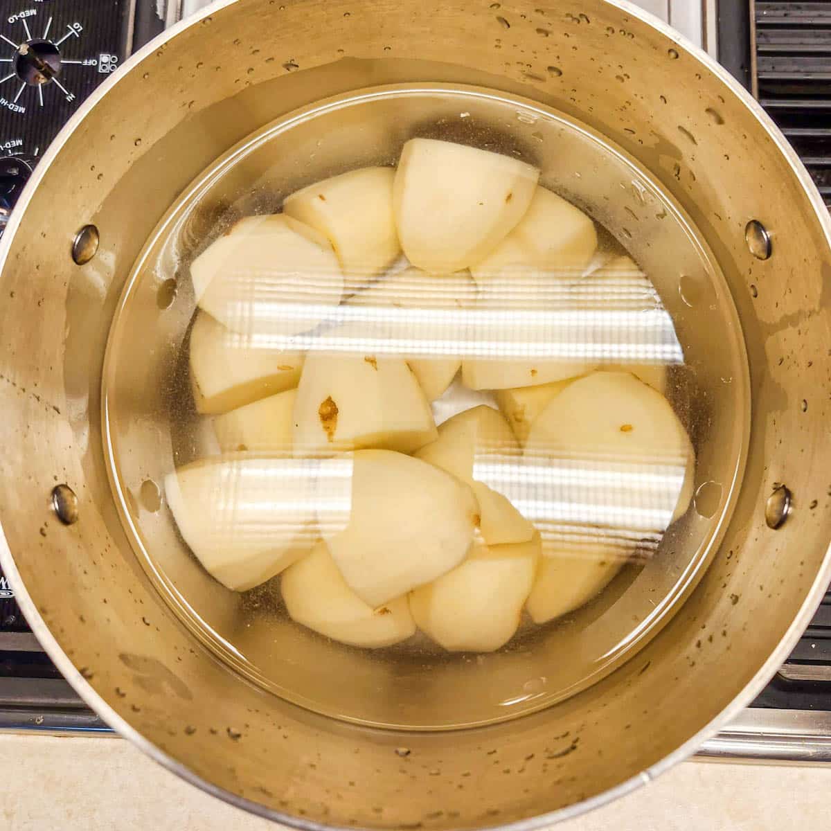 russet potatoes in water