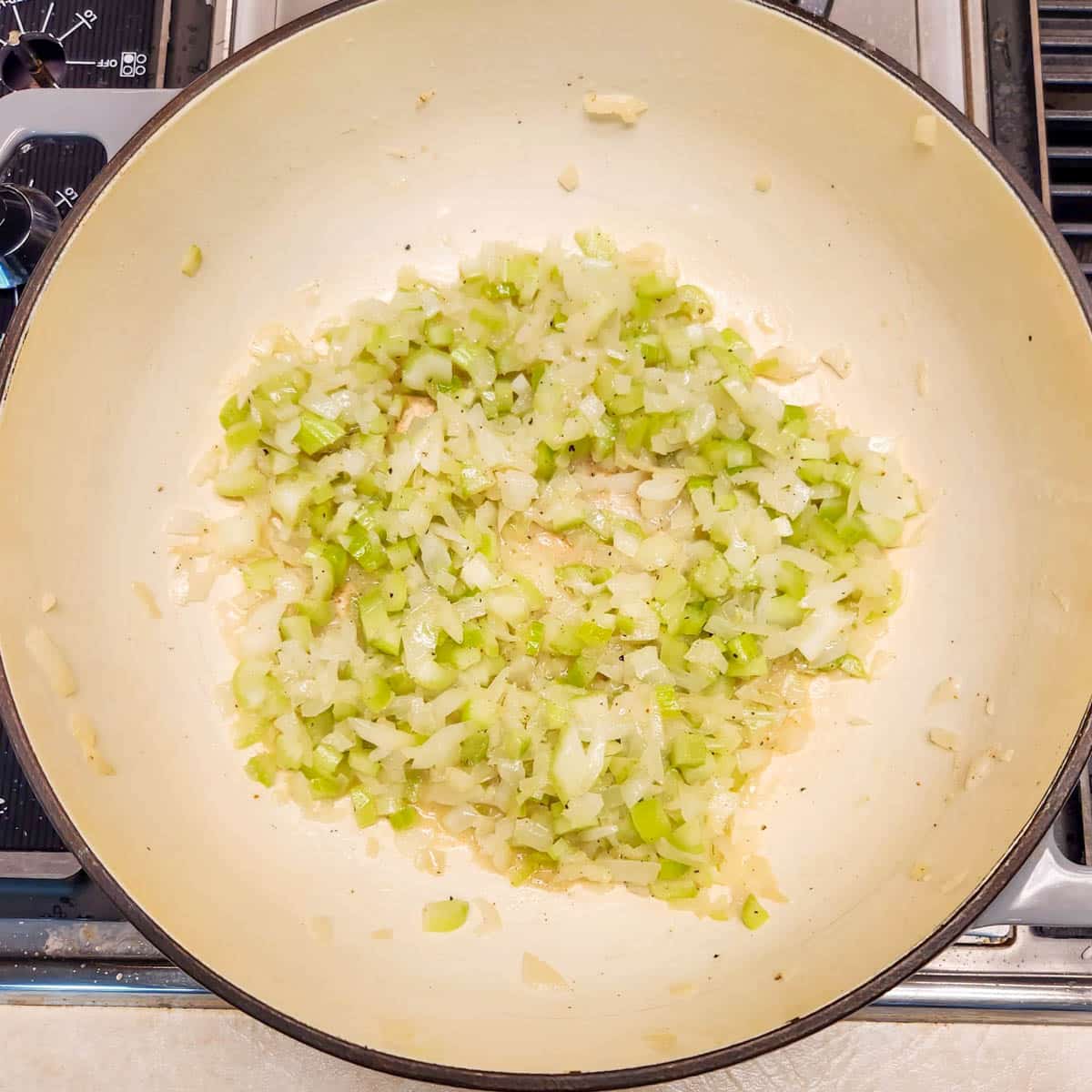 onions, celery and garlic sautéing in butter