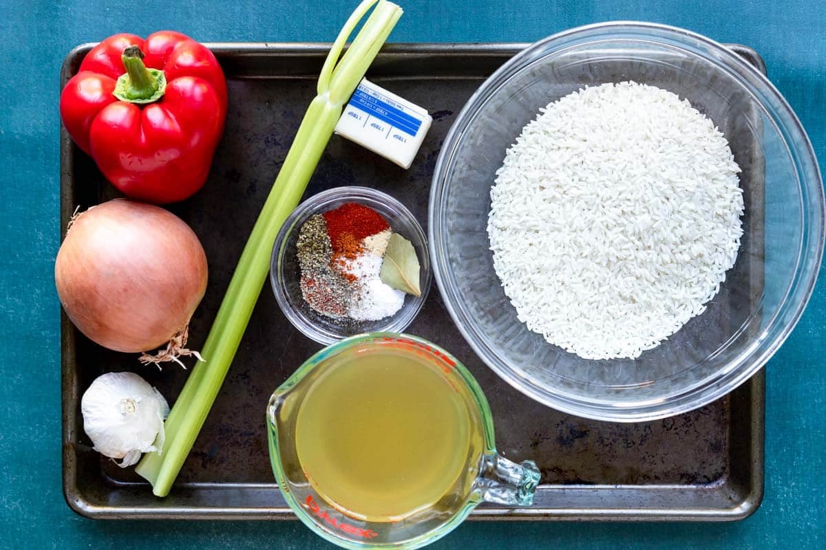 Ingredients on a sheet pan for Cajun Rice 