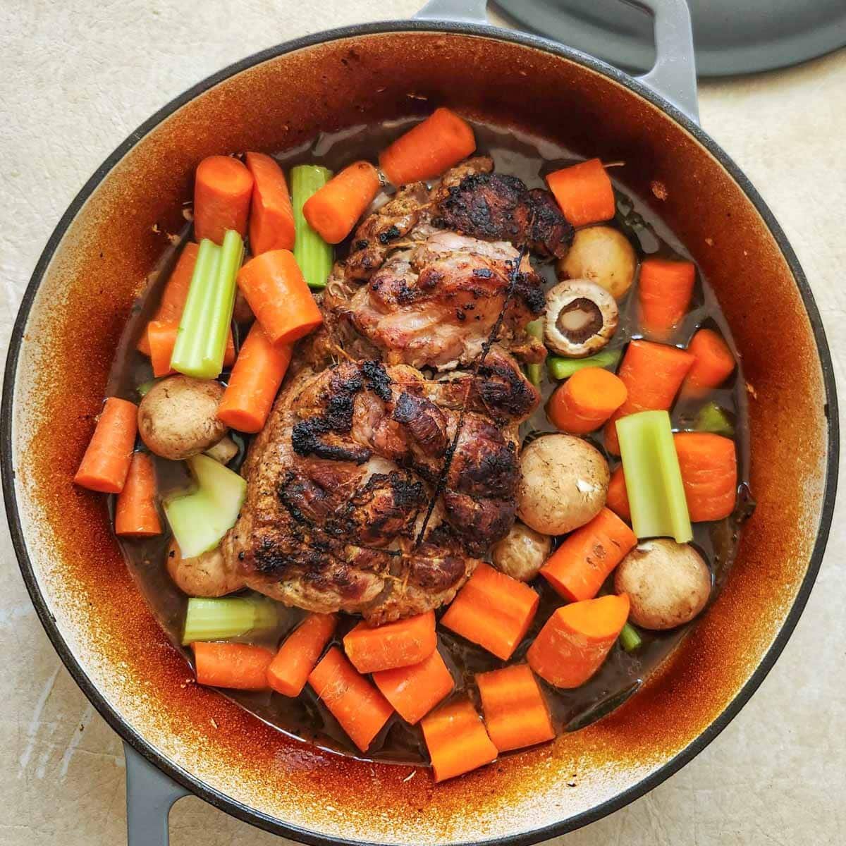 Roasted pork shoulder with veggies