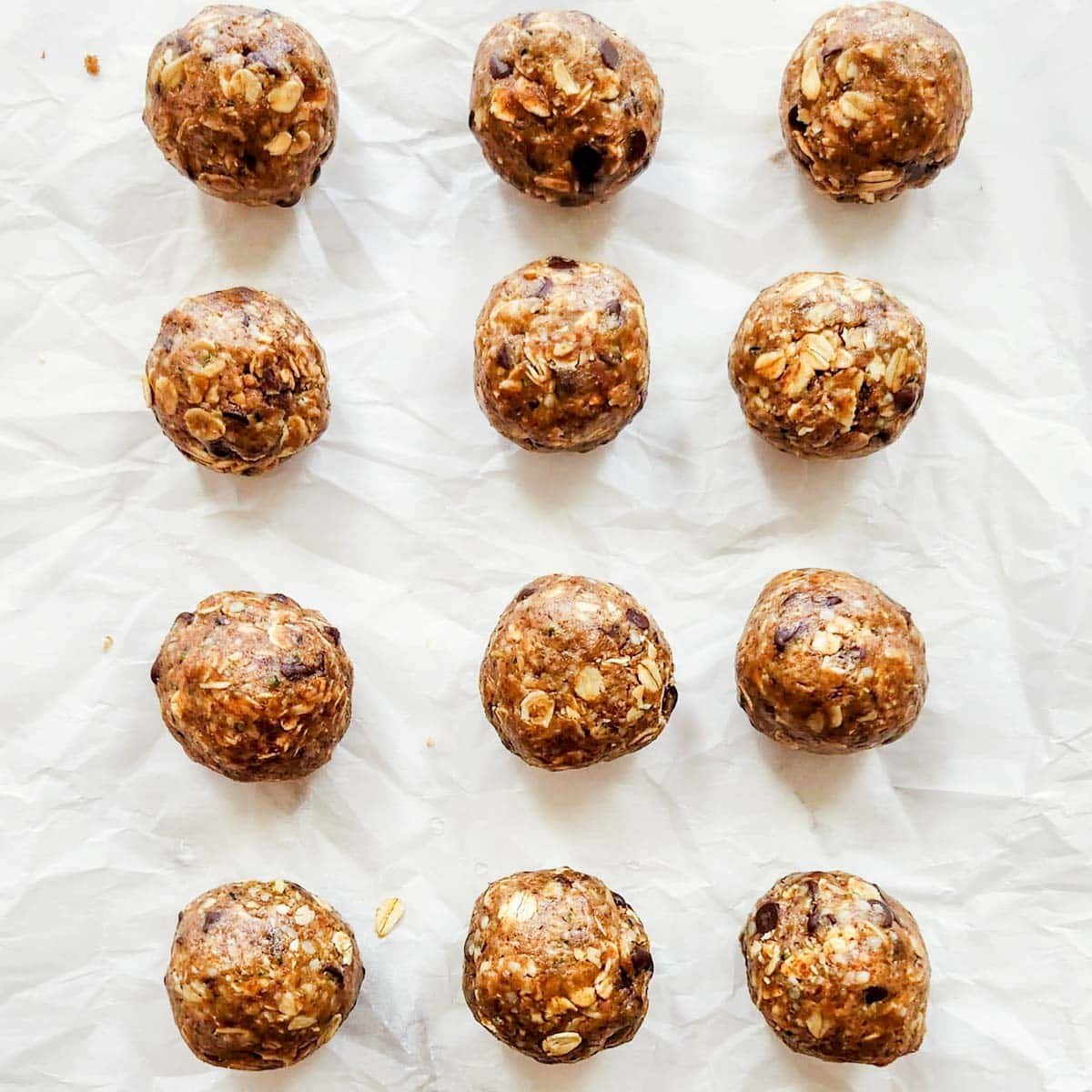 protein balls on a piece of parchment paper