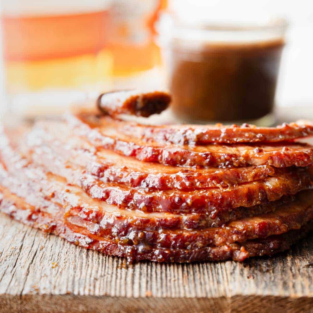 a pile of spiral cut ham with bourbon maple ham glaze