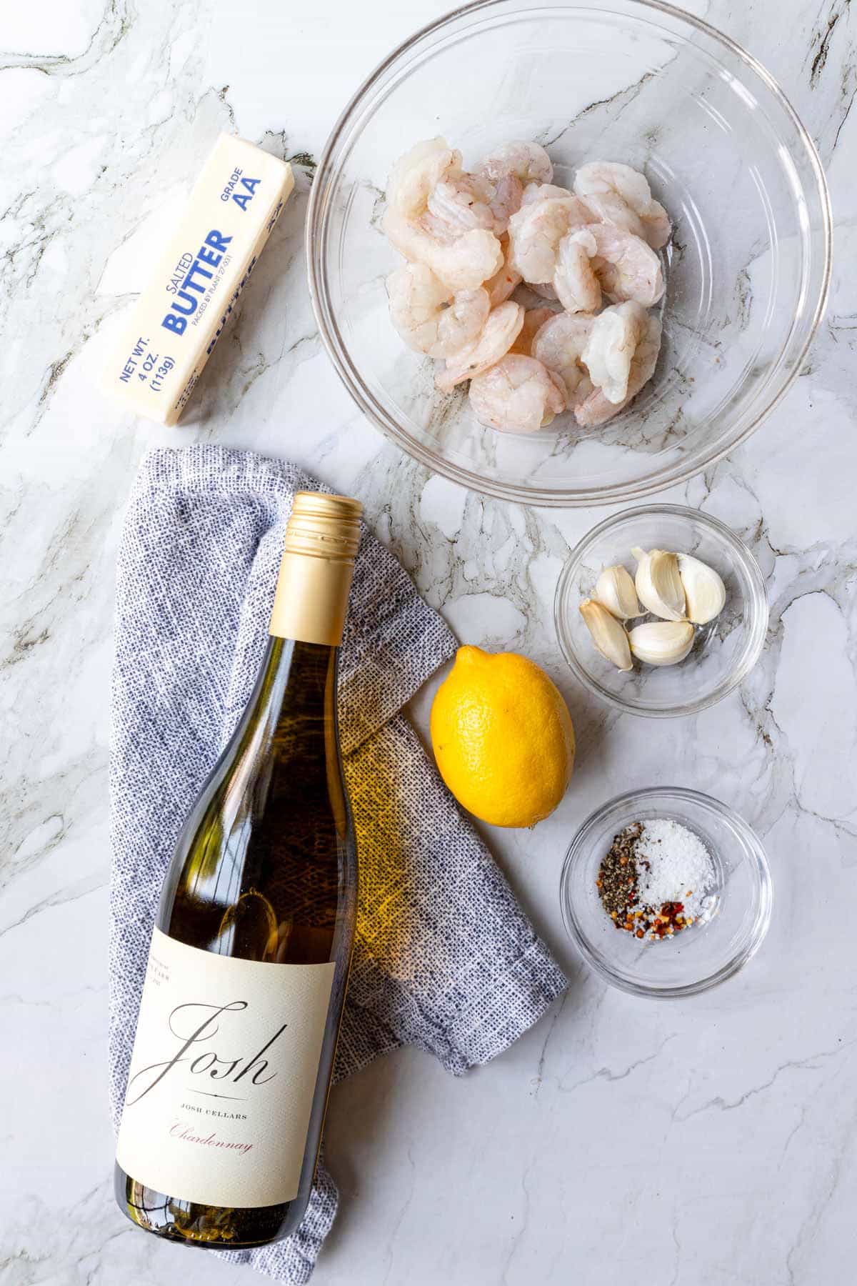 ingredients for white wine shrimp pasta  on a table