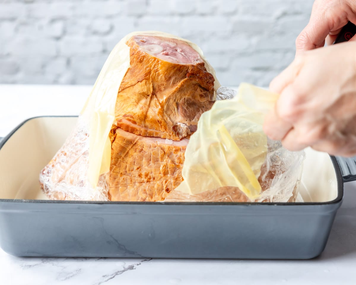 taking the packaging off a spiral ham