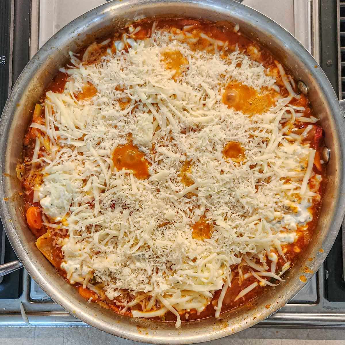 veggie lasagna skillet topped with mozzarella and parmesan 