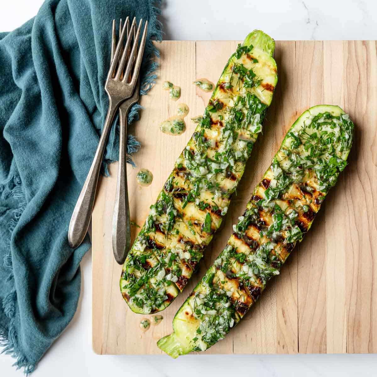 grilled zucchini topped with herb and garlic butter