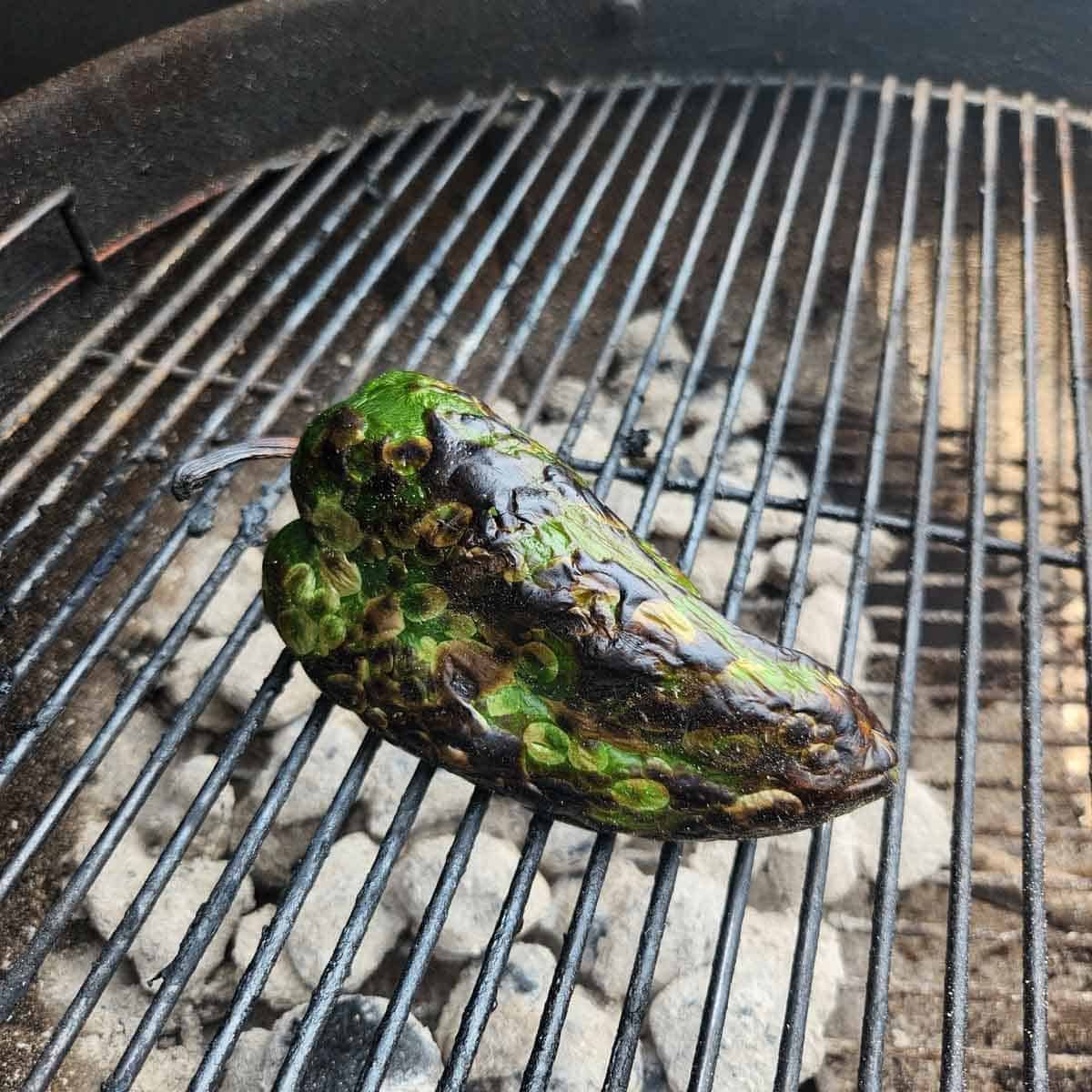 poblano roasting on a grill