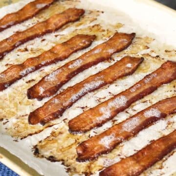 crispy bacon on a rimmed baking sheet