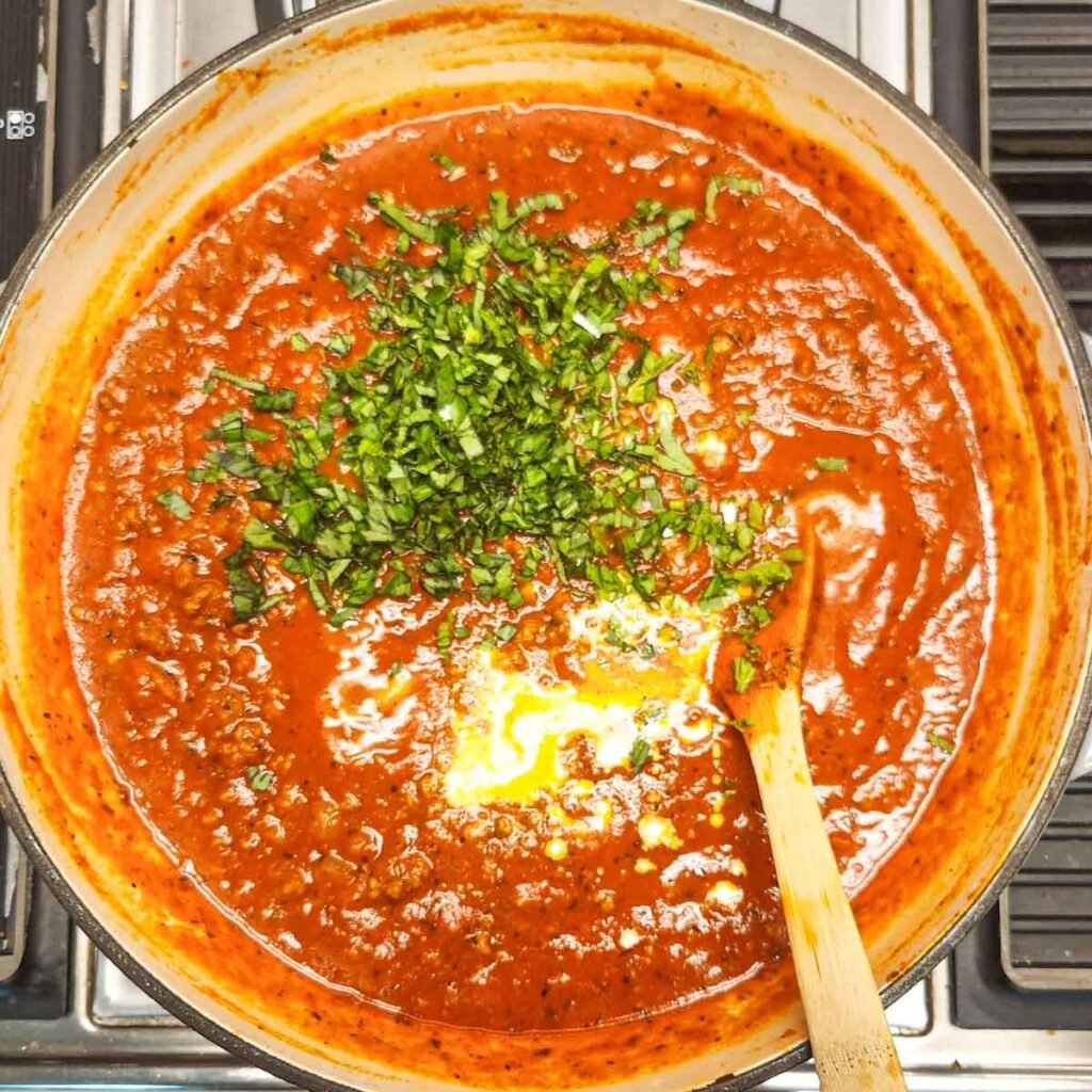 Chopped fresh basil and heavy cream added to the pasta sauce.