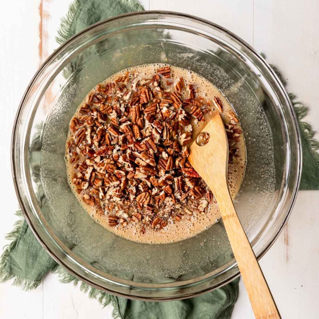 Pecan Pie Bar filling being stirred in a bowl 