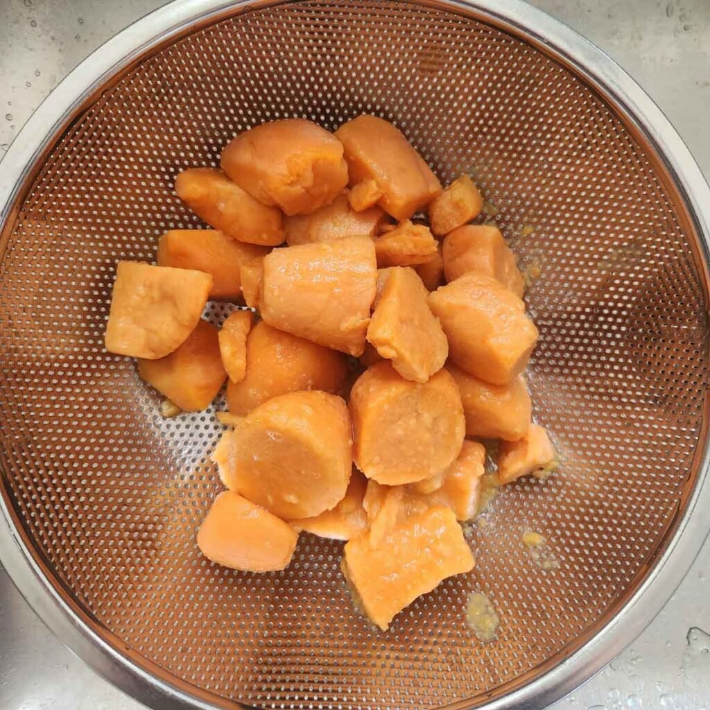 canned yams drained in a colander