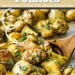 Pinterest image for Herb Roasted Potatoes with a wooden spoon scooping up the side dish.