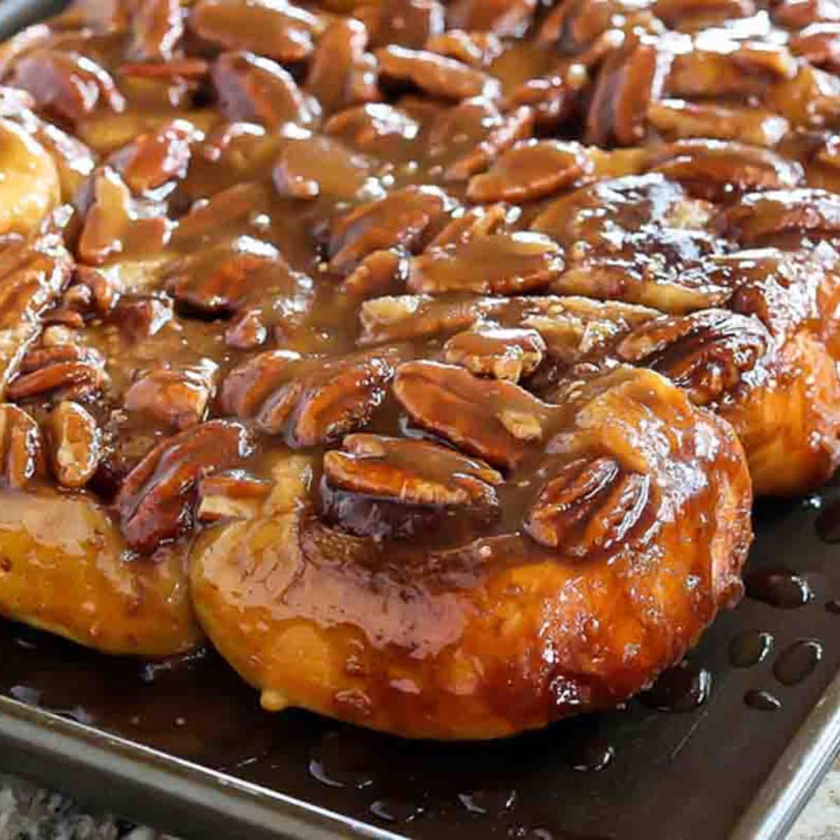 Sticky Pecan topped caramel rolls ready to serve.