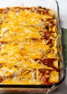 Melted cheese over beef enchiladas.
