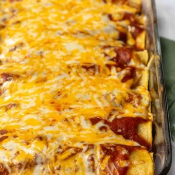 Melted cheese over beef enchiladas.