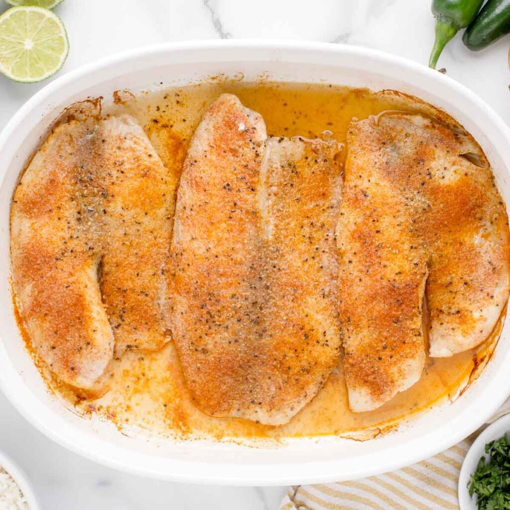 seasoned tilapia baked in a dish