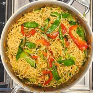 Sauce coating Lo Mein noodles and veggies mixed in to a skillet dinner.