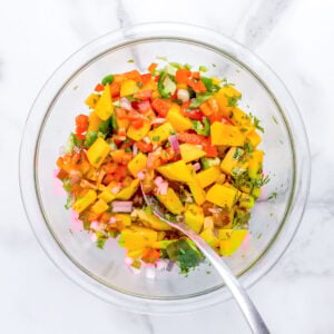 fresh mango salsa mixed in a bowl