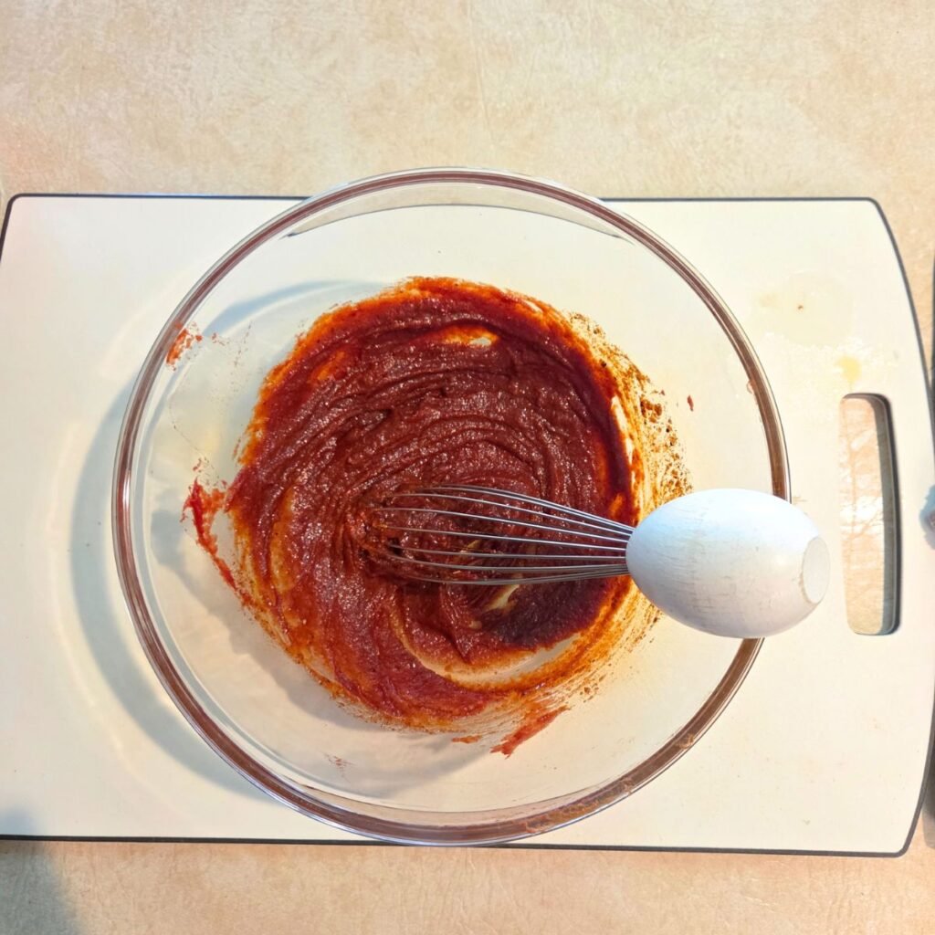 Chicken marinade being prepared in a mixing bowl.