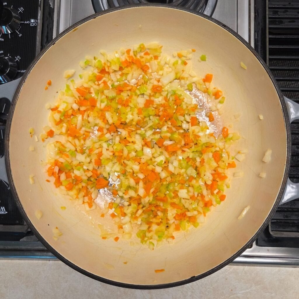 Sauteed veggies (soffrito) in a Dutch oven.