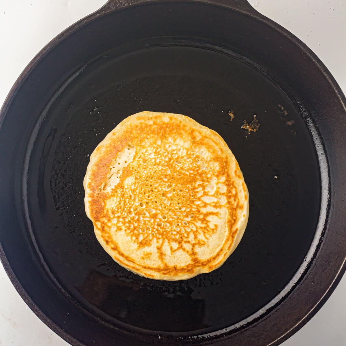 cooking a pancake in a skillet 