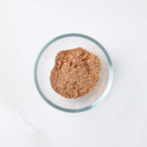 Dry rub seasonings combined in a small glass bowl.