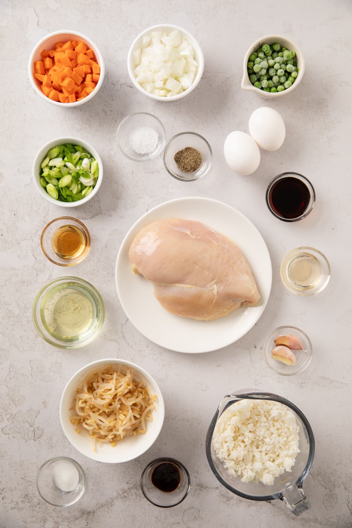 Ingredients shown are used to prepare chicken fried rice.